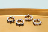 Pendientes de circonitas con microincrustaciones de diamantes de colores en forma de gota