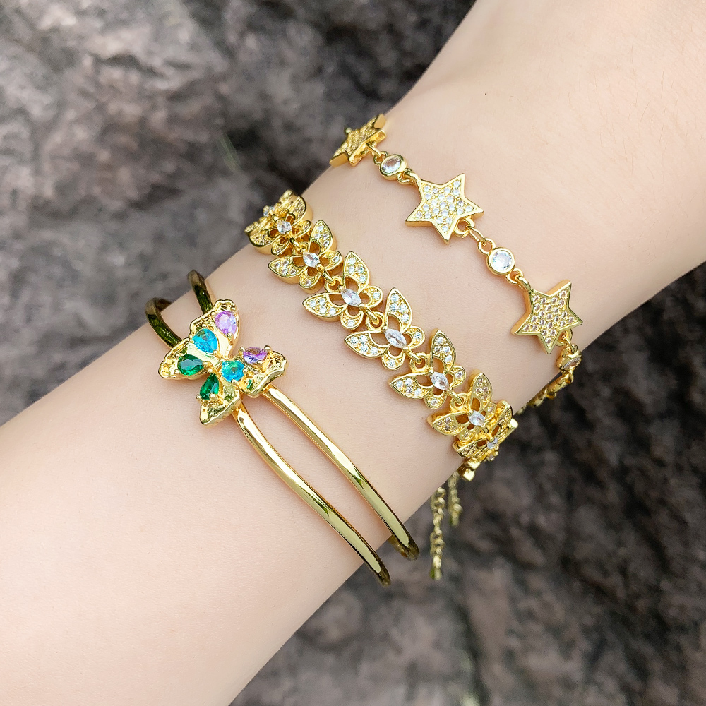 Pulseras chapadas en oro de 18 quilates con incrustaciones de cobre y mariposa de estrella de estilo simple a la moda