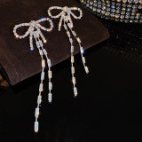1 par de pendientes colgantes de circón con incrustaciones de cobre y nudo de lazo en forma de corazón a la moda