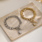 Pulseras chapadas en plata chapadas en oro de 18 quilates con incrustaciones de perlas artificiales con cerradura de llave de estilo simple