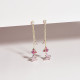 Pendientes largos creativos de cobre con circonita y mariposa morada