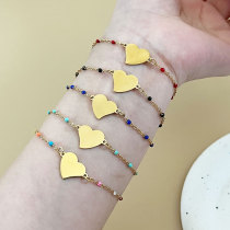 Pulseras chapadas en oro de titanio con revestimiento de acero en forma de corazón de estilo simple