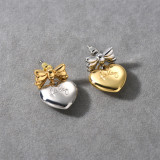 1 par de bonitos pendientes colgantes chapados en oro de 18 quilates con forma de corazón y lazo