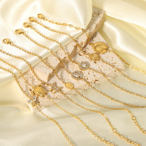 Pulseras chapadas en oro de 18K con incrustaciones de cadena chapada en acero inoxidable con forma de pez mariposa y flor elegante para mujer