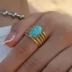 Anillos abiertos chapados en oro de 18 quilates con turquesa y embutido de acero inoxidable ovalado informal estilo IG