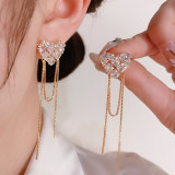1 par de pendientes colgantes elegantes con forma de corazón y borlas con incrustaciones de diamantes de imitación de cobre