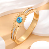 Brazalete chapado en oro con diamantes de imitación con incrustaciones de epoxi y acero de titanio con ojo artístico