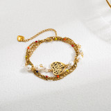 Pulseras chapadas en oro con perlas de imitación de acero inoxidable con forma de corazón de palma de ojo de diablo estilo INS al por mayor