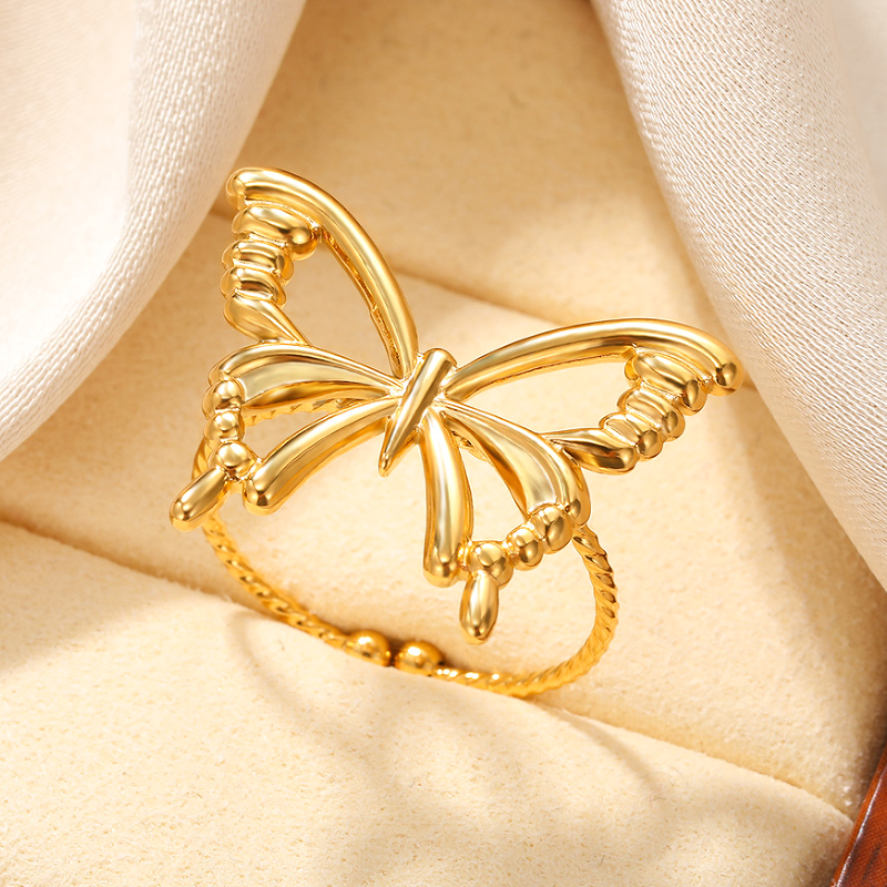 El chapado de acero inoxidable de la mariposa del estilo simple dulce al por mayor ahueca hacia fuera los anillos plateados oro 18K