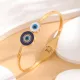 Brazalete chapado en oro con diamantes de imitación con incrustaciones de epoxi de acero y titanio con ojo de estilo vintage