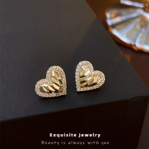 1 par de pendientes de circonita con incrustaciones de cobre en forma de corazón a la moda