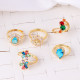 Anillos de circón de cobre con flores de estilo simple a granel
