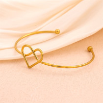 Pulseras de puño plateadas oro hechas a mano del acero inoxidable 18K del nudo de la forma del corazón del color sólido en bulto