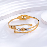 Brazalete chapado en oro de 24 quilates con incrustaciones de acero y titanio con bola de estilo simple informal