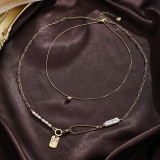 Collar con colgante chapado en plata chapado en oro de 18 quilates con incrustaciones de cobre y nudo de lazo de estilo barroco