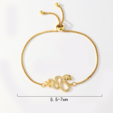 El chapado en cobre de la mariposa de la serpiente del estilo simple elegante ahueca hacia fuera las pulseras plateadas oro 18K del Zircon del embutido