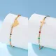 Pulseras plateadas en oro de 18K con revestimiento de cuentas de acero inoxidable en forma de corazón cruzado de viaje
