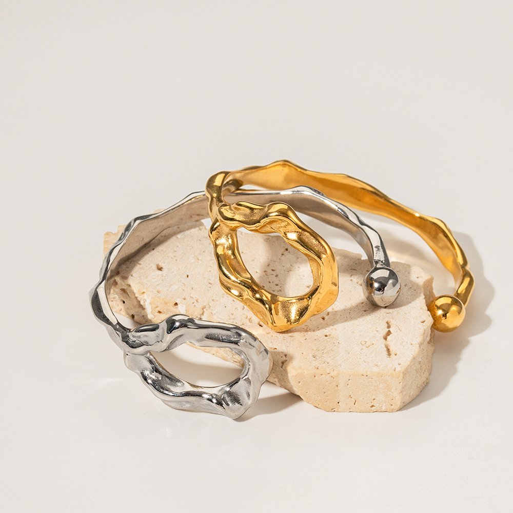 Pulseras de puño chapadas en oro de 18 quilates de acero inoxidable con revestimiento de acero inoxidable irregular estilo IG