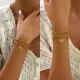 Venta al por mayor Hip-Hop Estilo simple Color sólido Forma de corazón Incrustaciones de revestimiento en capas de acero inoxidable Pulseras de diamantes de imitación chapadas en oro de 18 quilates