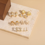 1 par de pendientes elegantes chapados en oro de 14K con incrustaciones asimétricas de cobre y forma de corazón y estrella