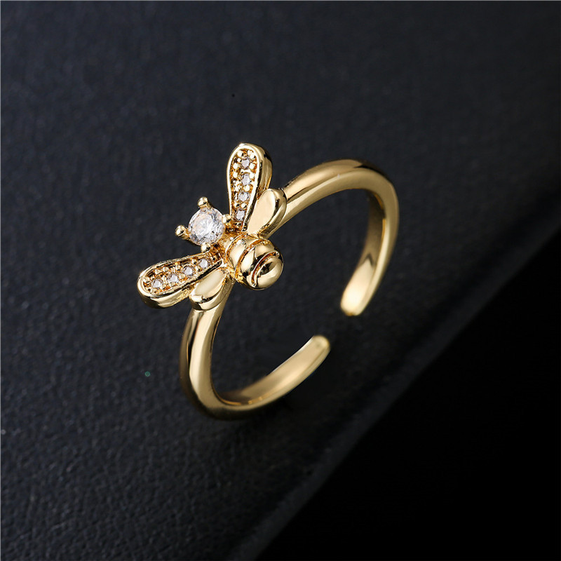 Anillo dividido de abeja de circonita con microincrustaciones de cobre simple