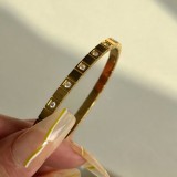 Brazalete de circonio chapado en oro de acero de titanio con ojo de estilo simple al por mayor