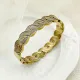 Brazalete chapado en oro con revestimiento de acero de titanio y acero inoxidable elegante