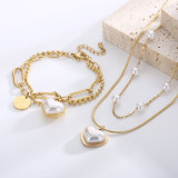 Collar elegante de las pulseras de la galjanoplastia de acero del titanio de la perla de agua dulce de la forma del corazón