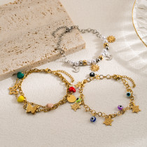 Pulseras chapadas en oro en capas de perlas de imitación de acero inoxidable con mariposa y ojo de diablo de estilo moderno