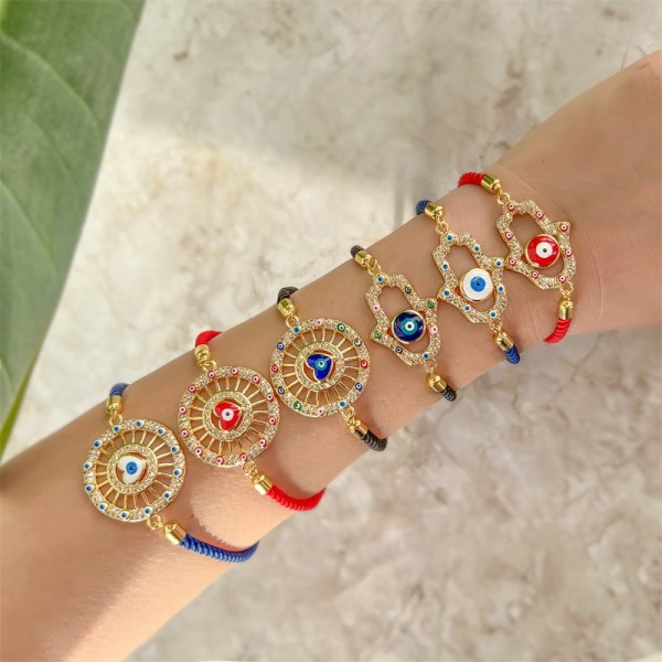 Estilo étnico Ojo del diablo Mano de Fátima Forma de corazón Incrustaciones de cobre Pulseras chapadas en oro de circón