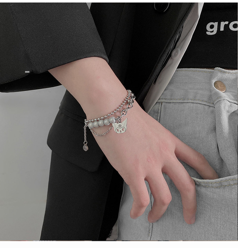 Versión coreana, pulsera de monstruo de doble capa, costura de perlas reflectantes, pulsera de acero de titanio, accesorios bonitos