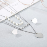 Conjunto de collar y pendientes de corazón de titanio multicapa, joyería al por mayor, nueva moda