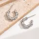 1 par de pendientes chapados en oro de 14 quilates de acero inoxidable chapado en forma de C de estilo moderno y sencillo