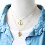 Collar con colgante chapado en oro de 18 quilates con incrustaciones de cobre y acero inoxidable con forma de corazón de fe artística