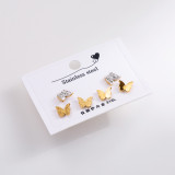 1 Juego de pendientes elegantes de acero inoxidable con llave de mariposa y cara sonriente para mujer