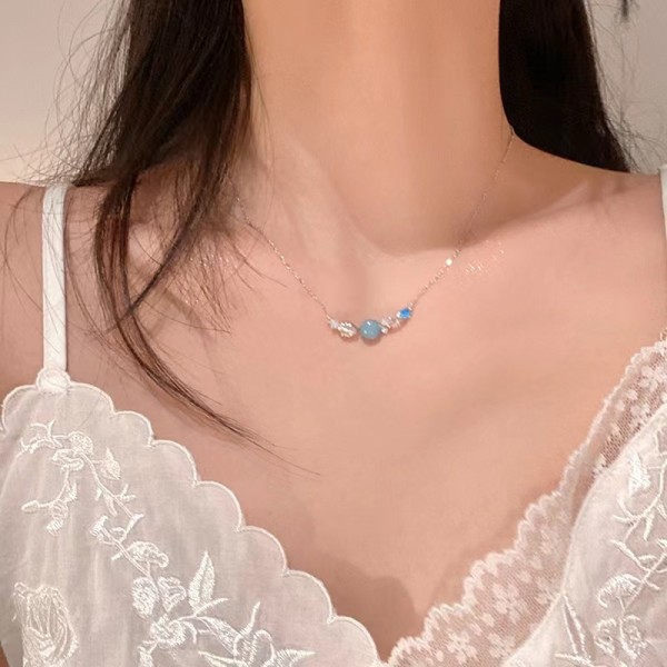 Collar de circonitas de acero y titanio de concha de estilo moderno a granel