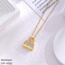 Collar chapado en oro con diamantes de imitación con incrustaciones de acero inoxidable y tierra con orejas de conejo de estilo simple