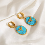 1 par de pendientes chapados en oro con circonita y acero de titanio con incrustaciones ovaladas elegantes