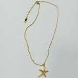 Collar chapado en oro de 18 quilates con incrustaciones de diamantes de imitación y pulido de acero de estrella de mar de playa