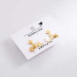 1 Juego de pendientes elegantes de acero inoxidable con llave de mariposa y cara sonriente para mujer