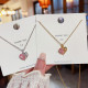 Collar con colgante de piedras preciosas artificiales con incrustaciones de cobre y acero titanio en forma de corazón dulce