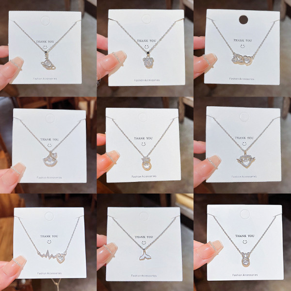 Collar con colgante de diamantes de imitación con incrustaciones de acero titanio y corona en forma de corazón y estrella a la moda