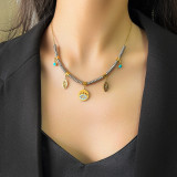 Collar retro con incrustaciones de acero y titanio y turquesa