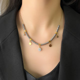 Collar retro con incrustaciones de acero y titanio y turquesa