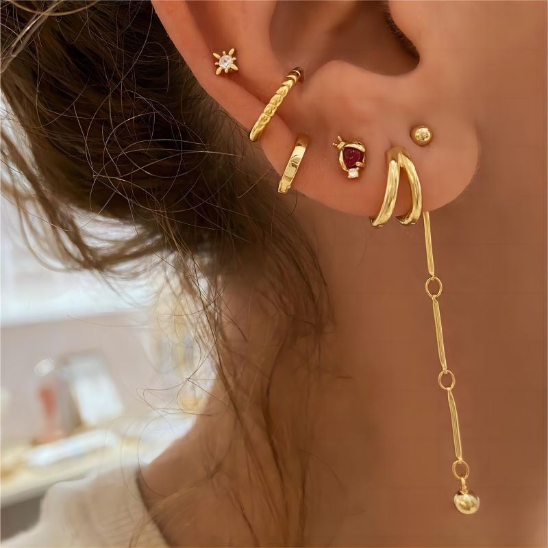 1 par de aretes de aro chapados en oro de 18 quilates de acero inoxidable con revestimiento torcido de estilo simple e informal