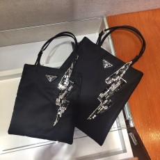 Prada ladies degradable nylon plain portable tote shoping bag with diamond-decorated lightning-shape pendant at top handle 