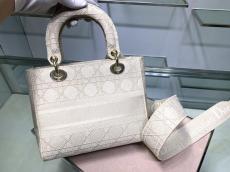 Dior sleek medium lady D-Lite handbag elegant canvas lightweight shopping tote bag with symbolic decorative Dior charm and reversible and detached wide shoulder strap 