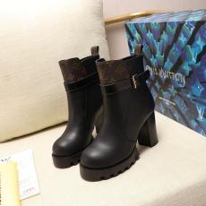 Louis Vuitton/LV lady's mixed-material leather ankle boot with distinctive chunky heal and treaded platform 