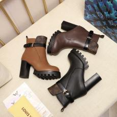 Louis Vuitton/LV lady's mixed-material leather ankle boot with distinctive chunky heal and treaded platform 