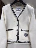 Chanel female luxury ready to wear couture socialite cropped jacket warm autumn coat with braided trim and embroidered camellia pattern on side pock